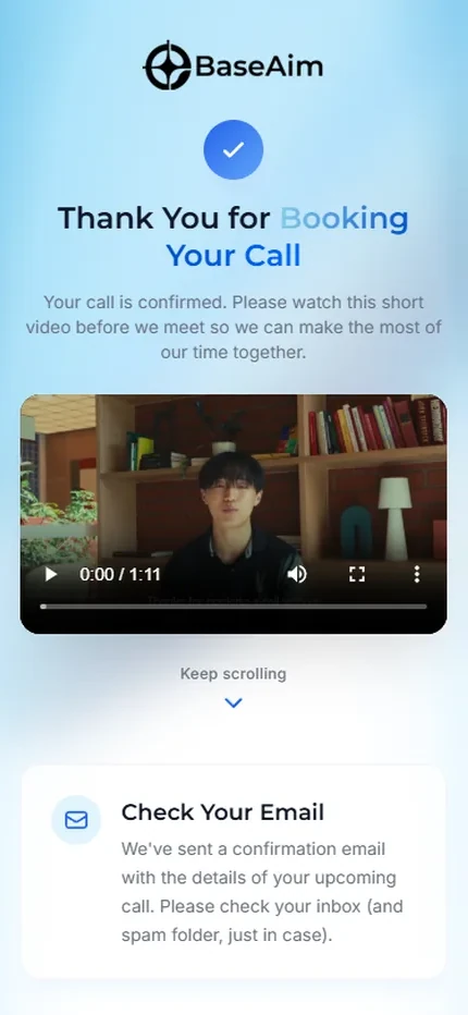 The thank-you page on a phone: the booking confirmed with a tick, a short video to watch before the call, and a note that a confirmation email has been sent.
